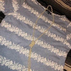 Cute light blue shirt with pearl necklace